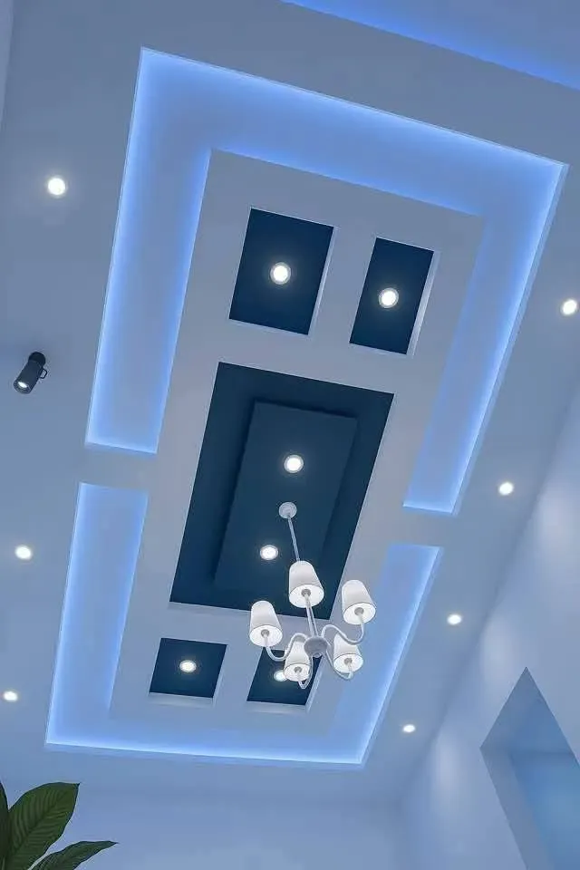 Ceiling with blue LED lighting and spotlights