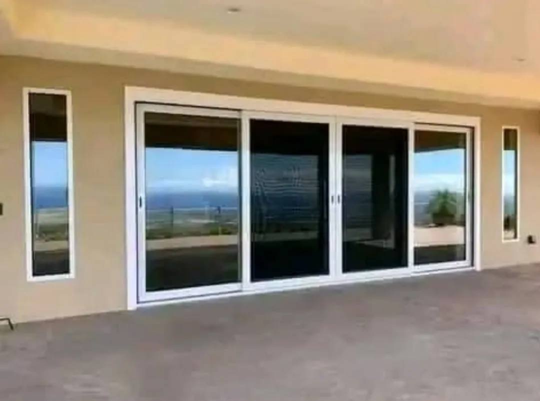 Aluminium sliding glass doors opening onto a terrace, by SIMMAS